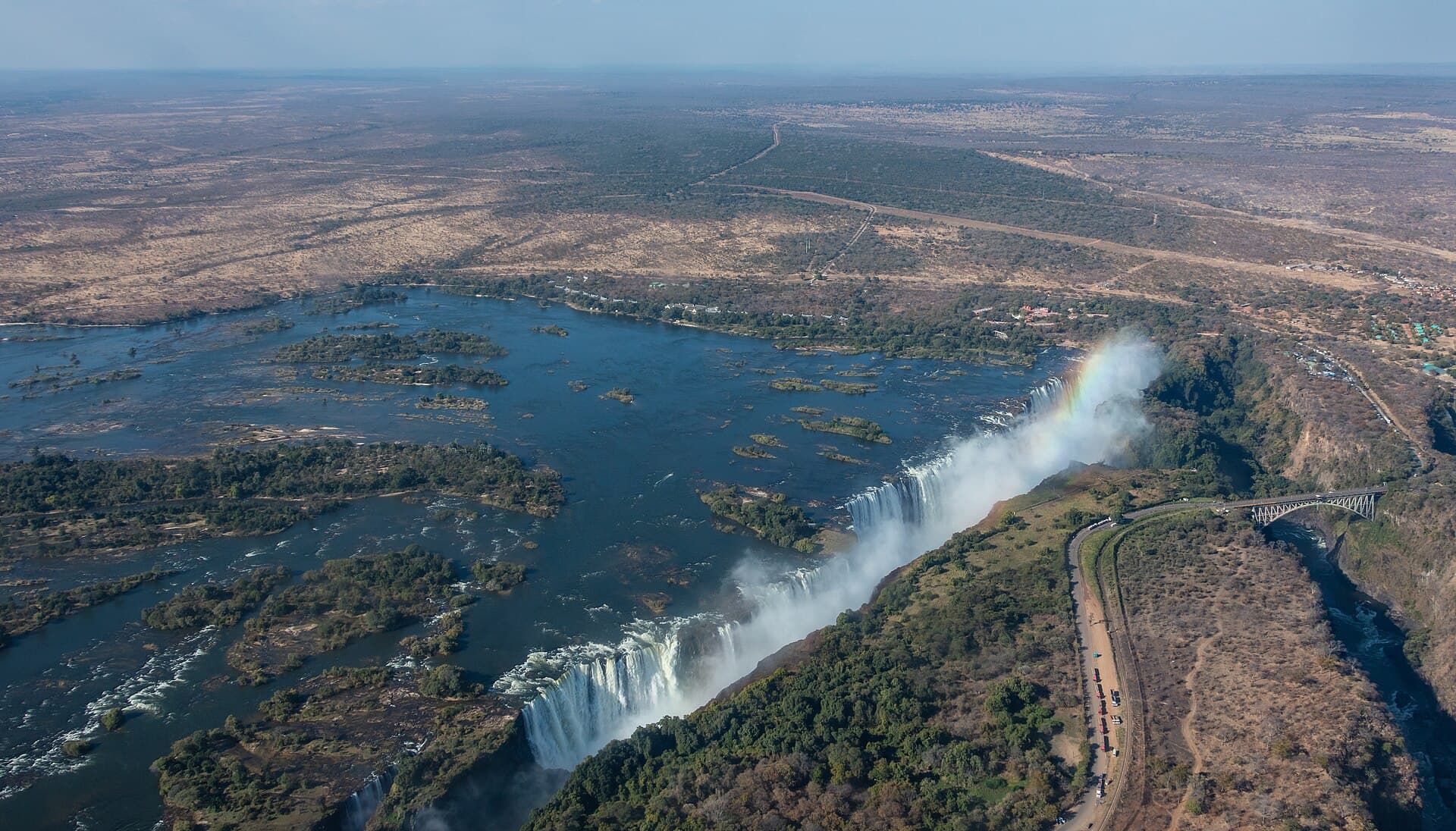 Aerial view of Victoria Falls with a rainbow over the gorge